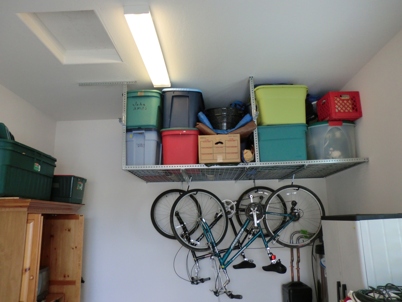 Overhead storage racks with bike hangers